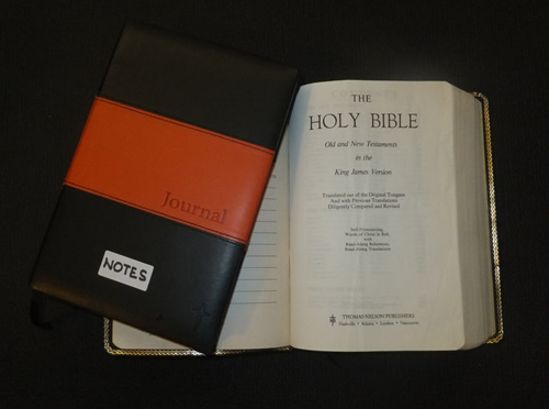 Holy bible and notepad